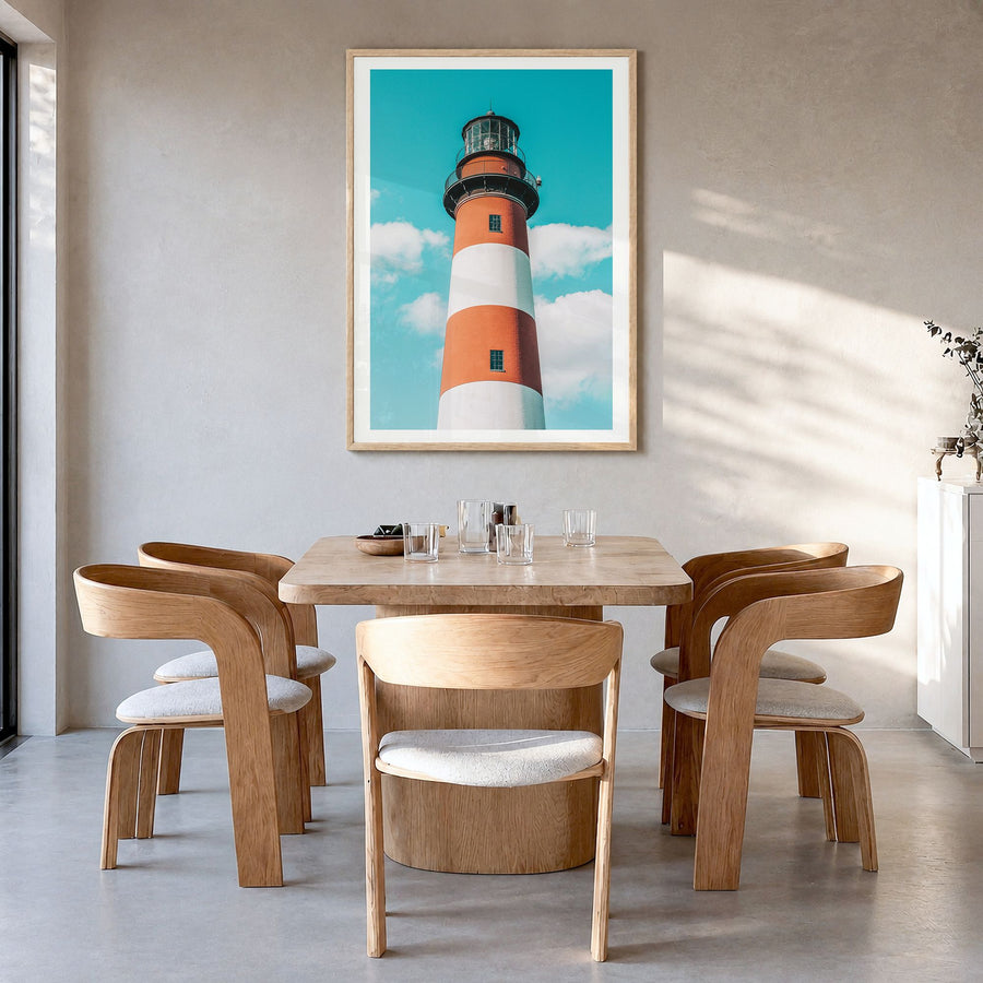 Chincoteague Photo Poster in a natural wood frame, hanging in a dining room, white border