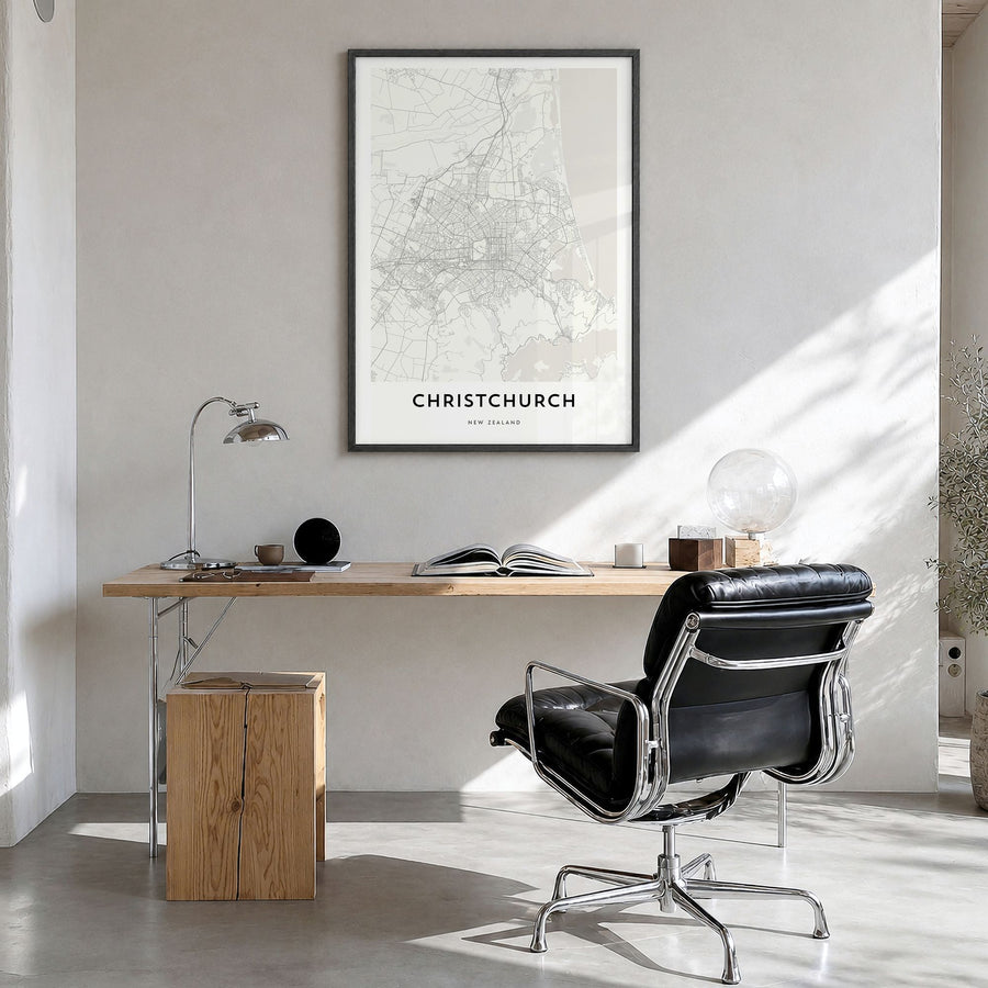 Christchurch Map Poster in a black wood frame, hanging in a bright home office