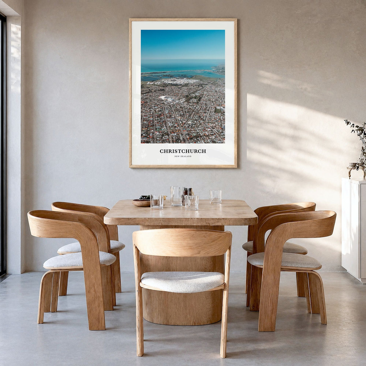 Christchurch Classic Poster in a natural wood frame, hanging in a dining room