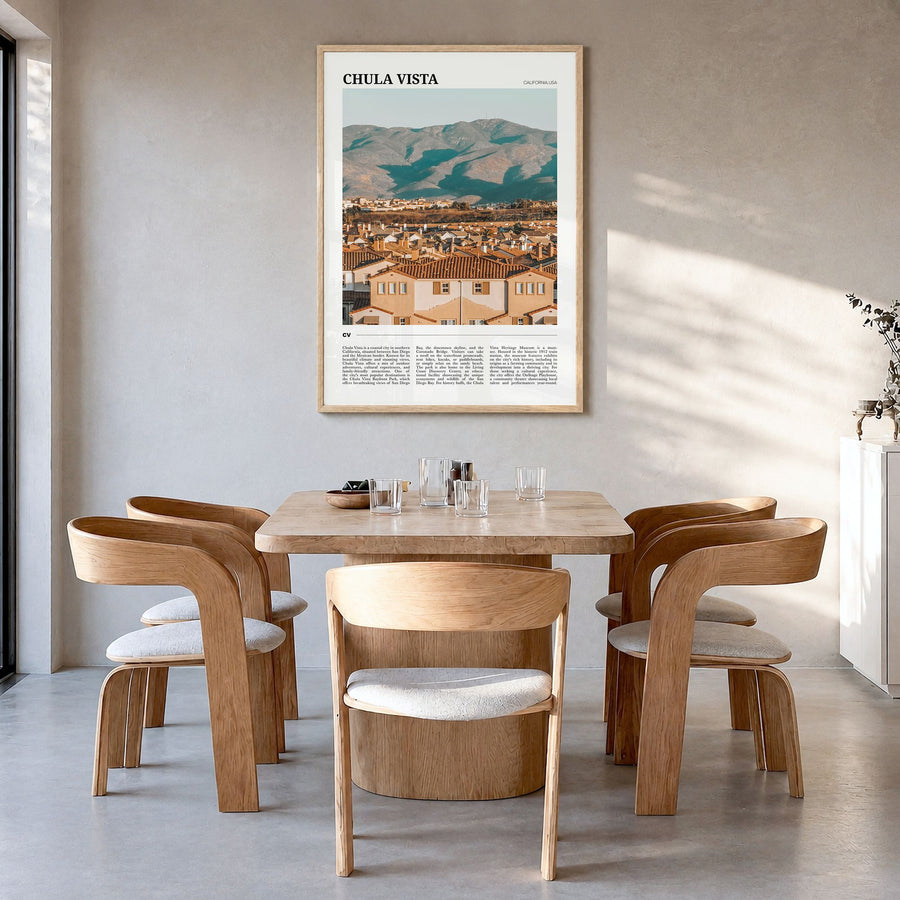 Chula Vista Travel Poster in a natural wood frame, hanging in a dining room