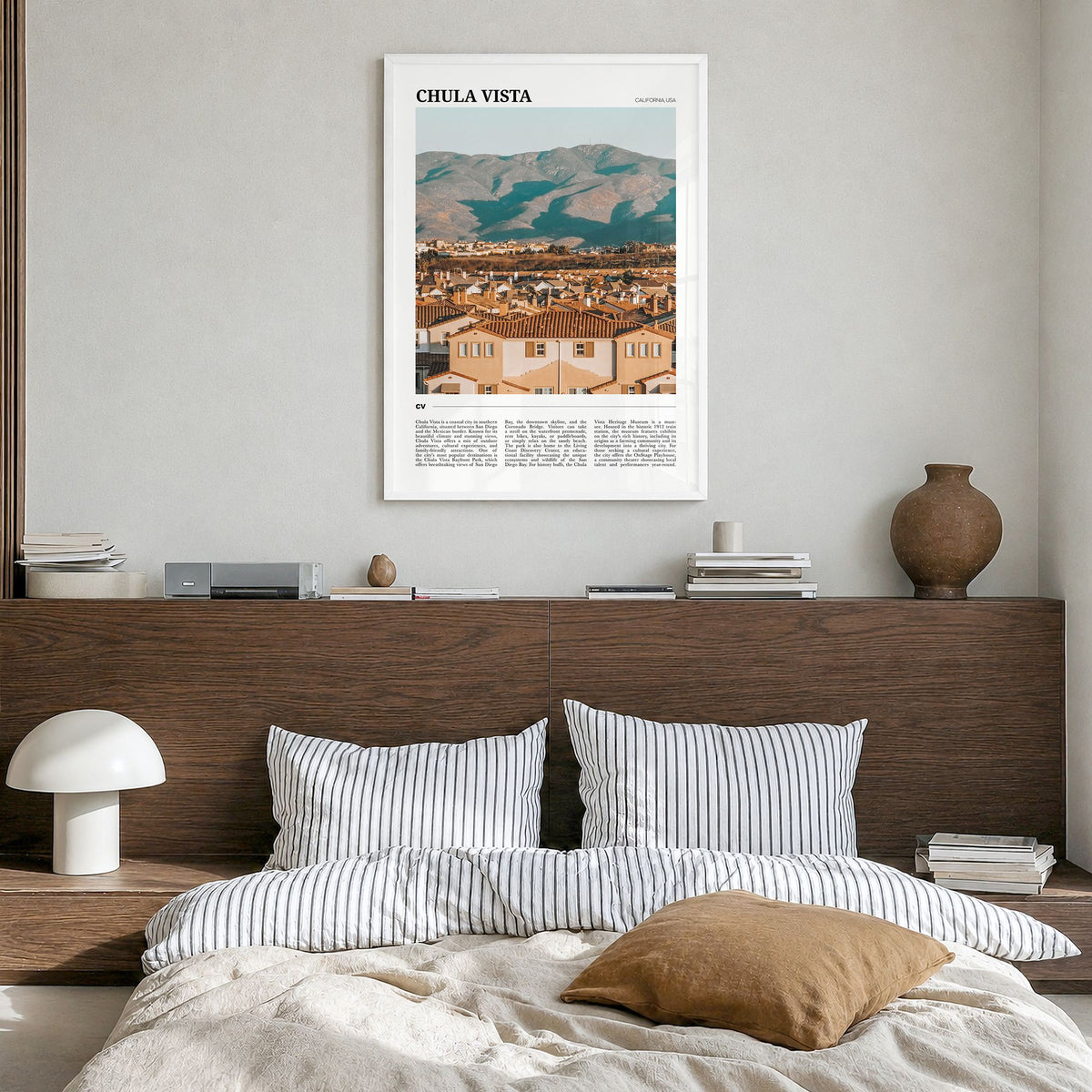 Chula Vista Travel Poster in a white wood frame, hanging in a bedroom