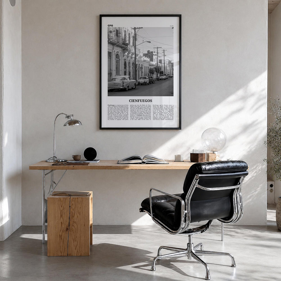 Cienfuegos black & white newspaper poster of Cuba – vertical wall art in black wood frame, hanging on wall