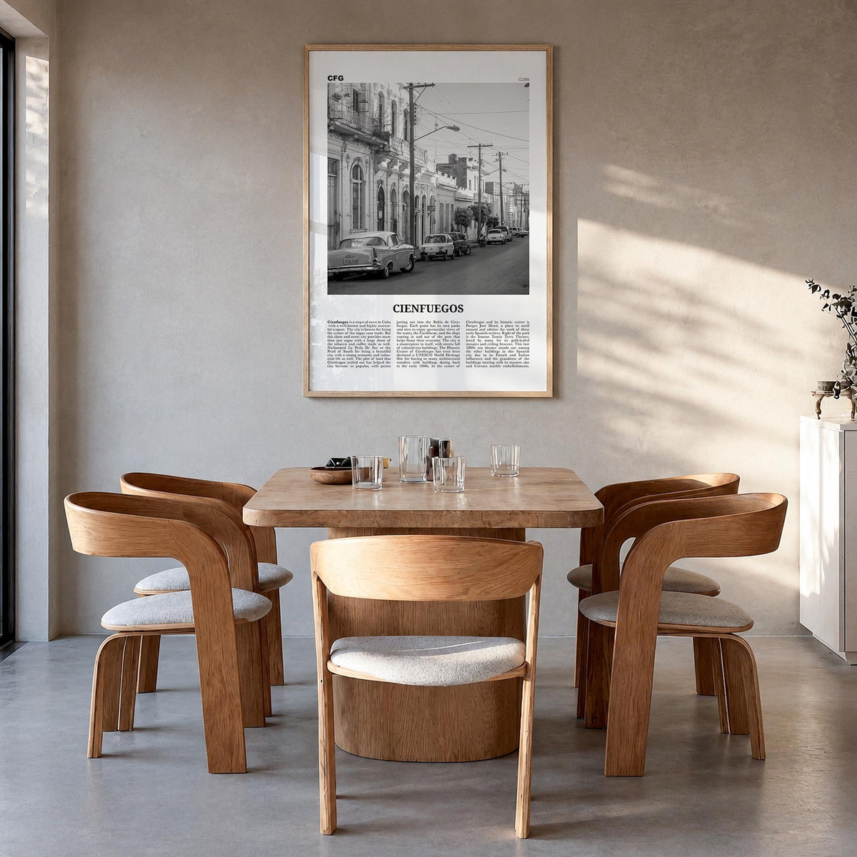 Cienfuegos black & white newspaper poster of Cuba – vertical wall art in natural wood frame, hanging on wall