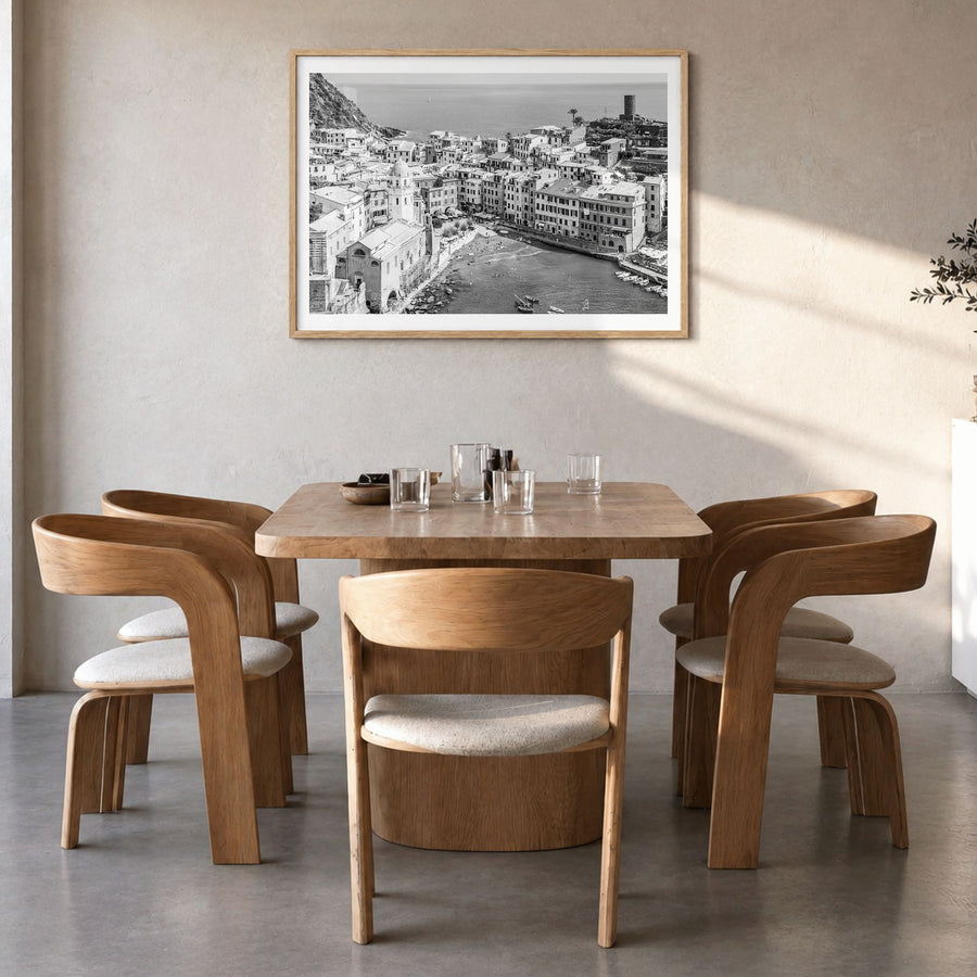 Cinque Terre Photo Poster in a natural wood frame, hanging in a dining room, white border