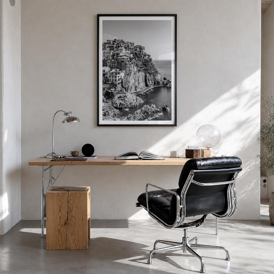 Cinque Terre no. 1 black & white photo poster of Italy – vertical wall art in black wood frame with white border, hanging on 