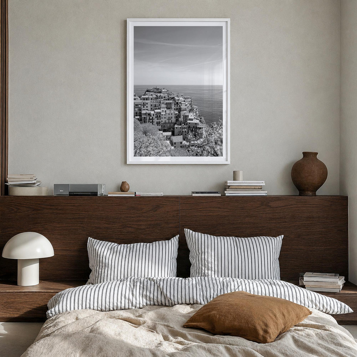 Cinque Terre no. 2 black & white photo poster of Italy – vertical wall art in white wood frame with white border, hanging on 