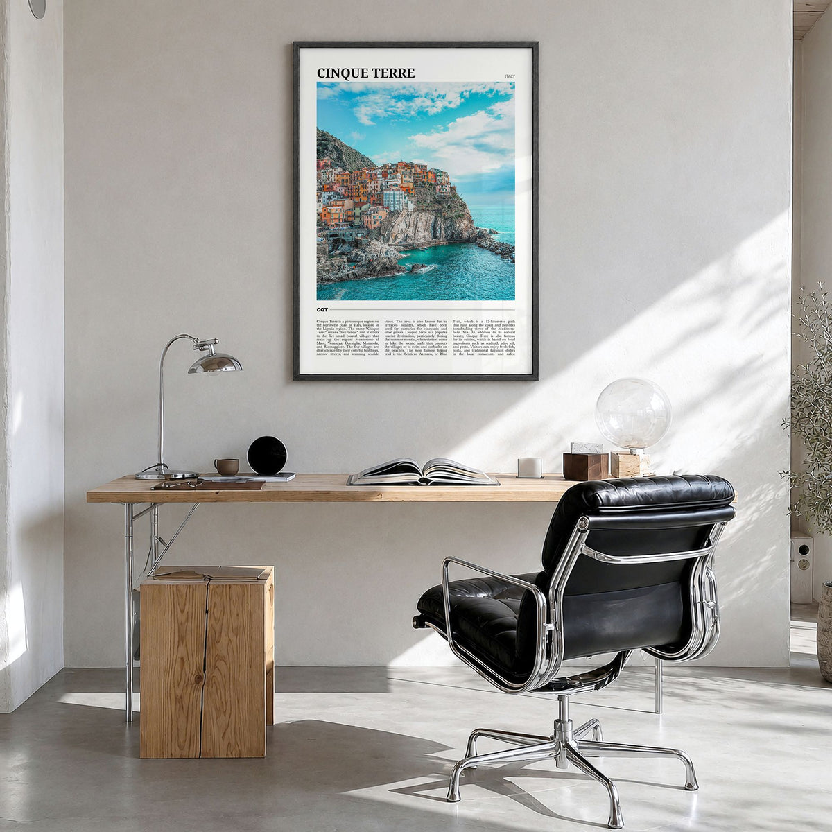 Cinque Terre Travel Poster in a black wood frame, hanging in a bright home office