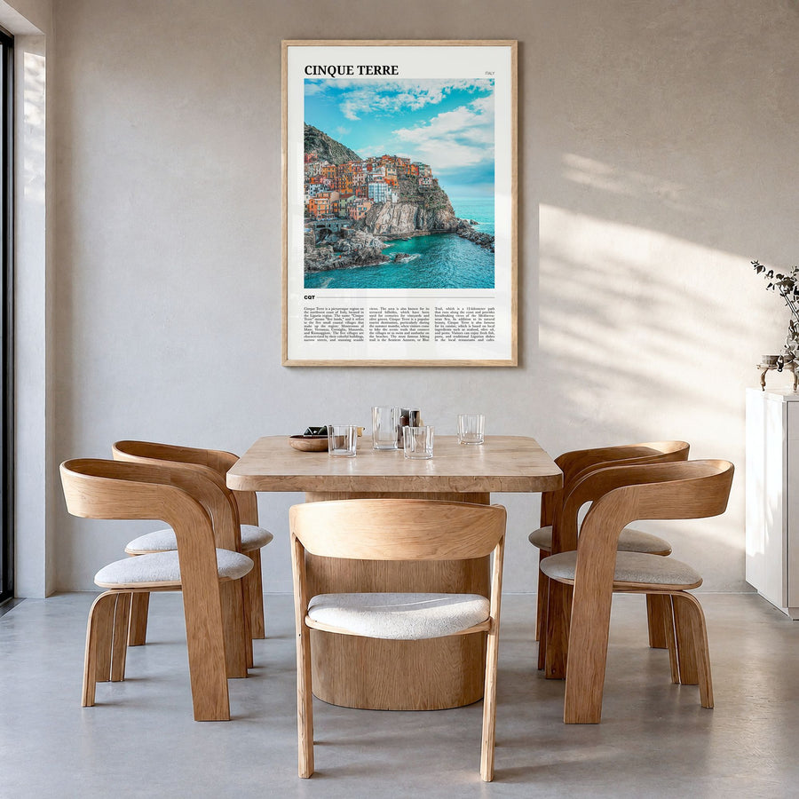 Cinque Terre Travel Poster in a natural wood frame, hanging in a dining room