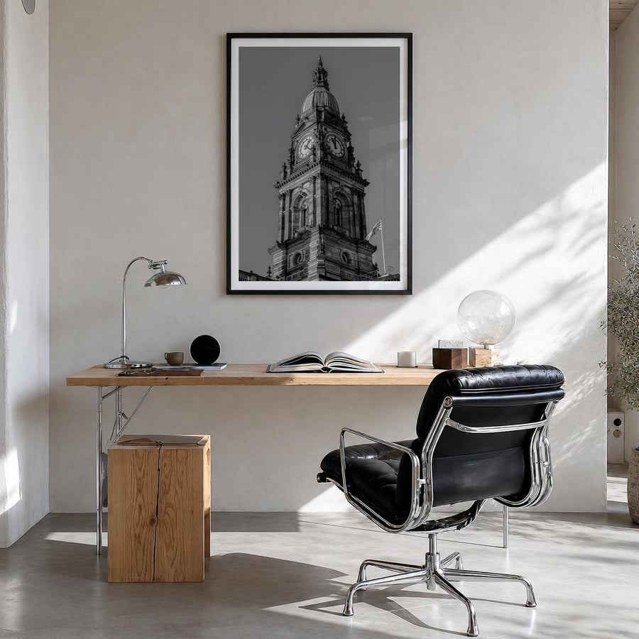 City Clock Pillar no. 1 black & white photo poster – vertical wall art in black wood frame with white border, hanging on wall