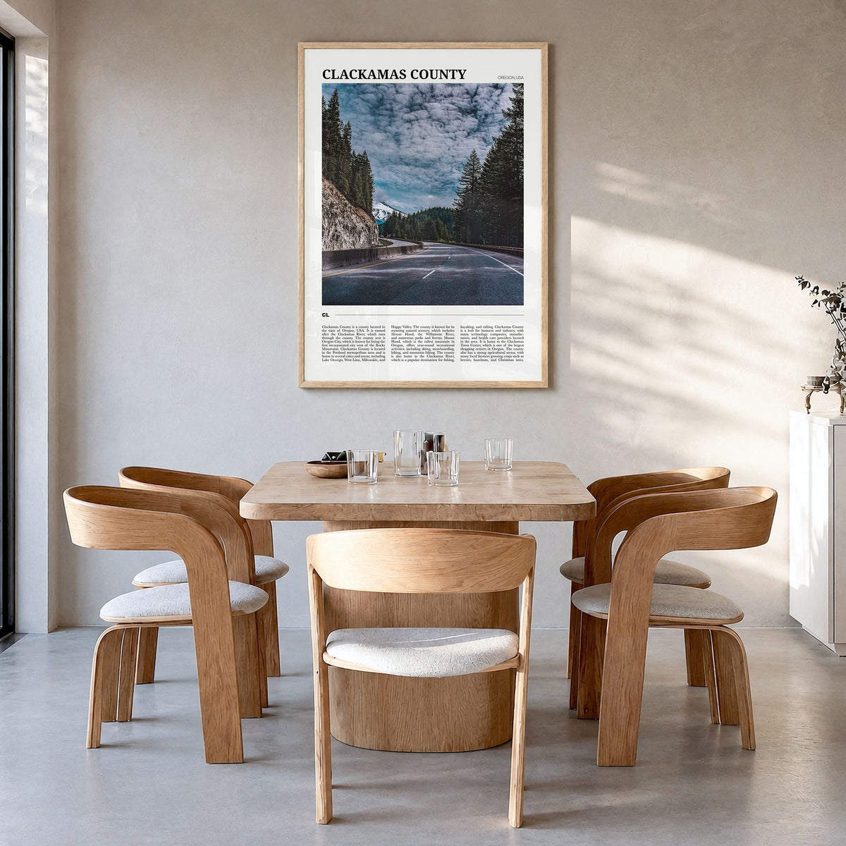 Clackamas County Travel Poster in a natural wood frame, hanging in a dining room