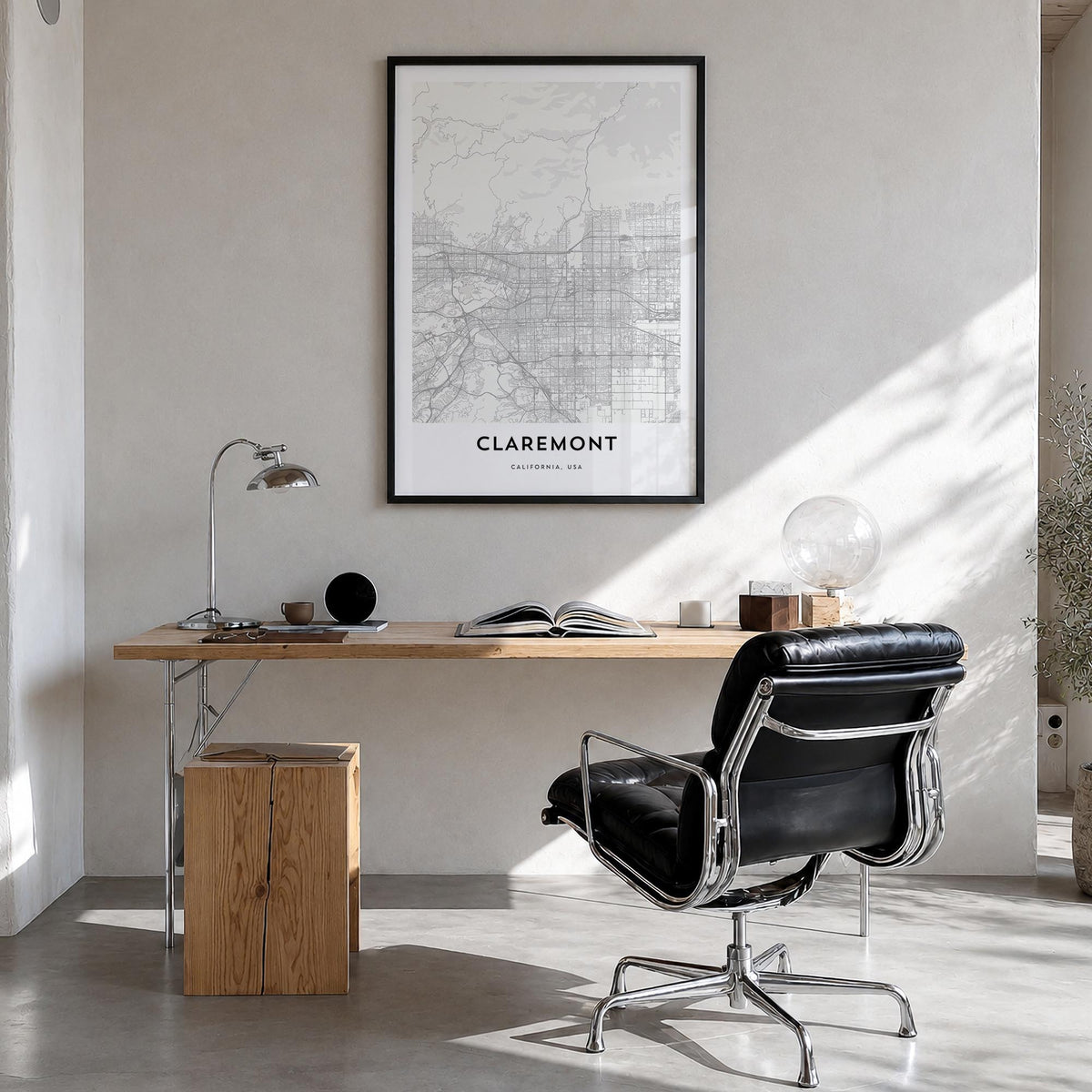 Claremont black & white map poster of California, USA – vertical wall art in black wood frame, hanging on wall