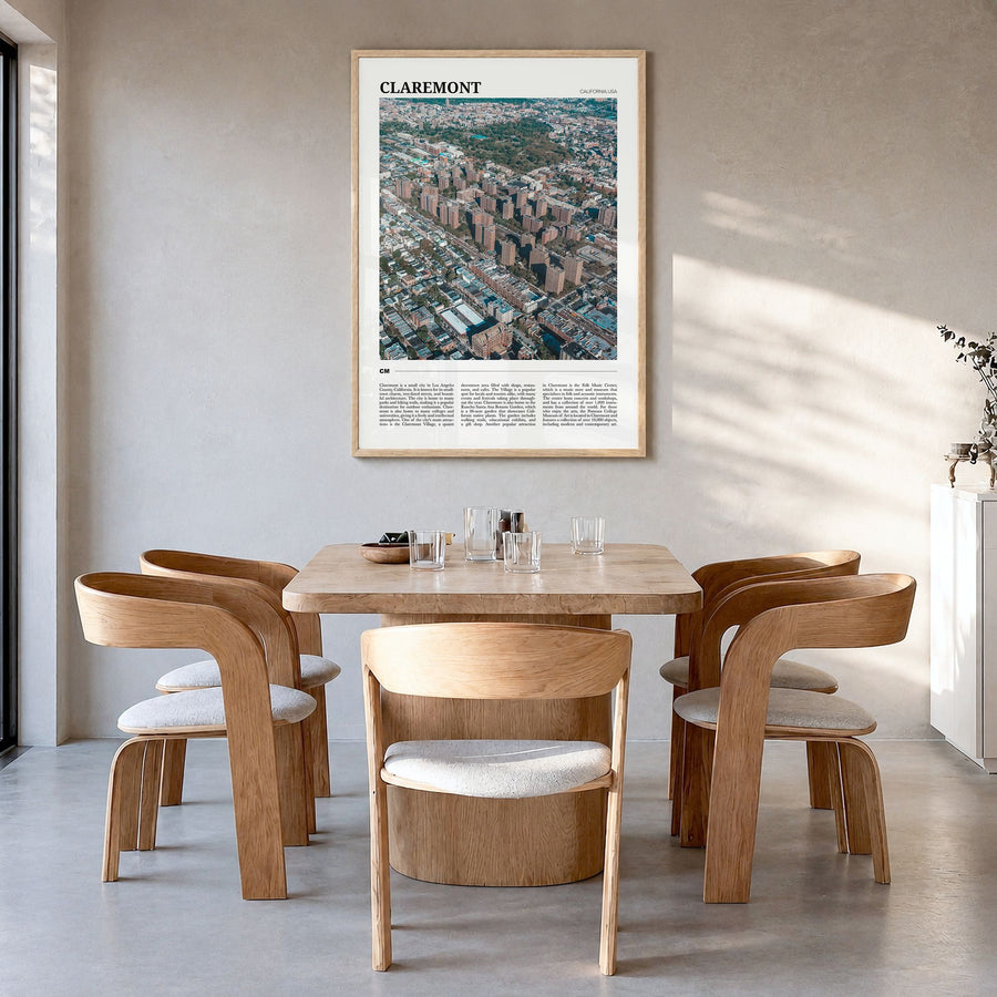 Claremont Travel Poster in a natural wood frame, hanging in a dining room