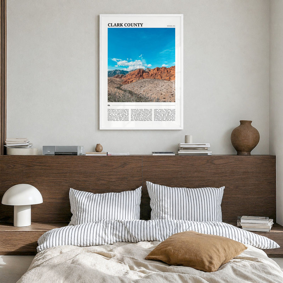 Clark County Travel Poster in a white wood frame, hanging in a bedroom