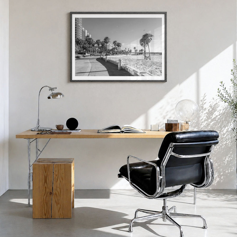 Clearwater Photo Poster in a black wood frame, hanging in a bright home office, white border