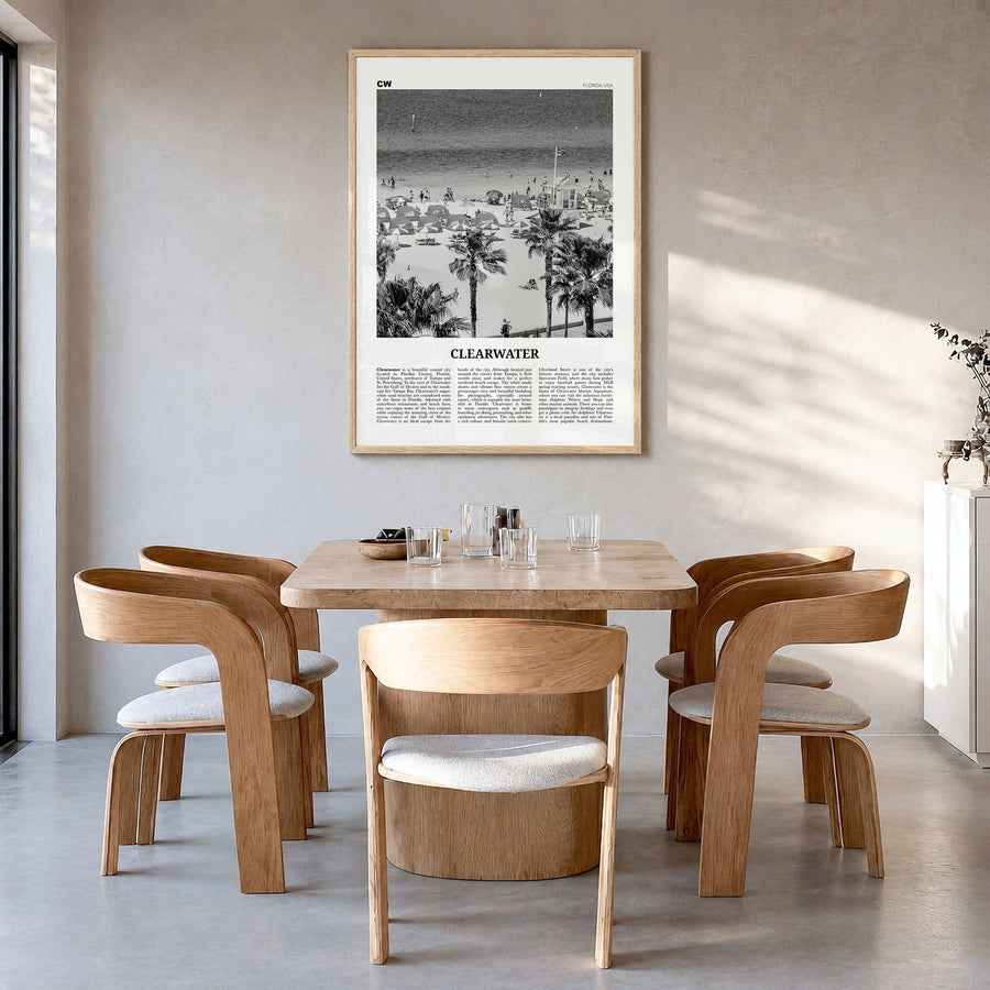 Clearwater Newspaper Poster in a natural wood frame, hanging in a dining room