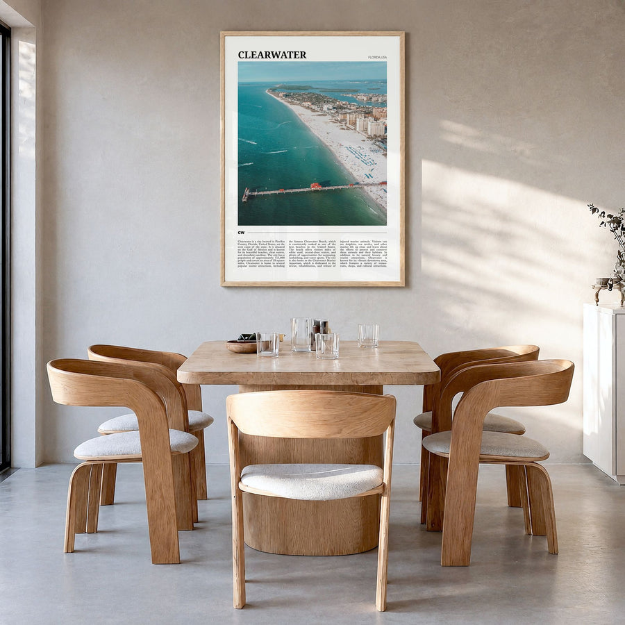 Clearwater Travel Poster in a natural wood frame, hanging in a dining room