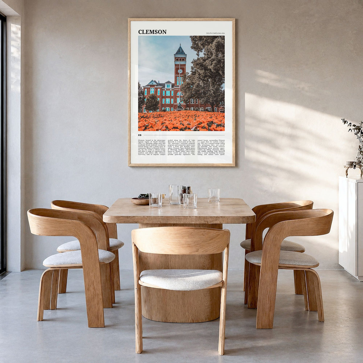 Clemson Travel Poster in a natural wood frame, hanging in a dining room