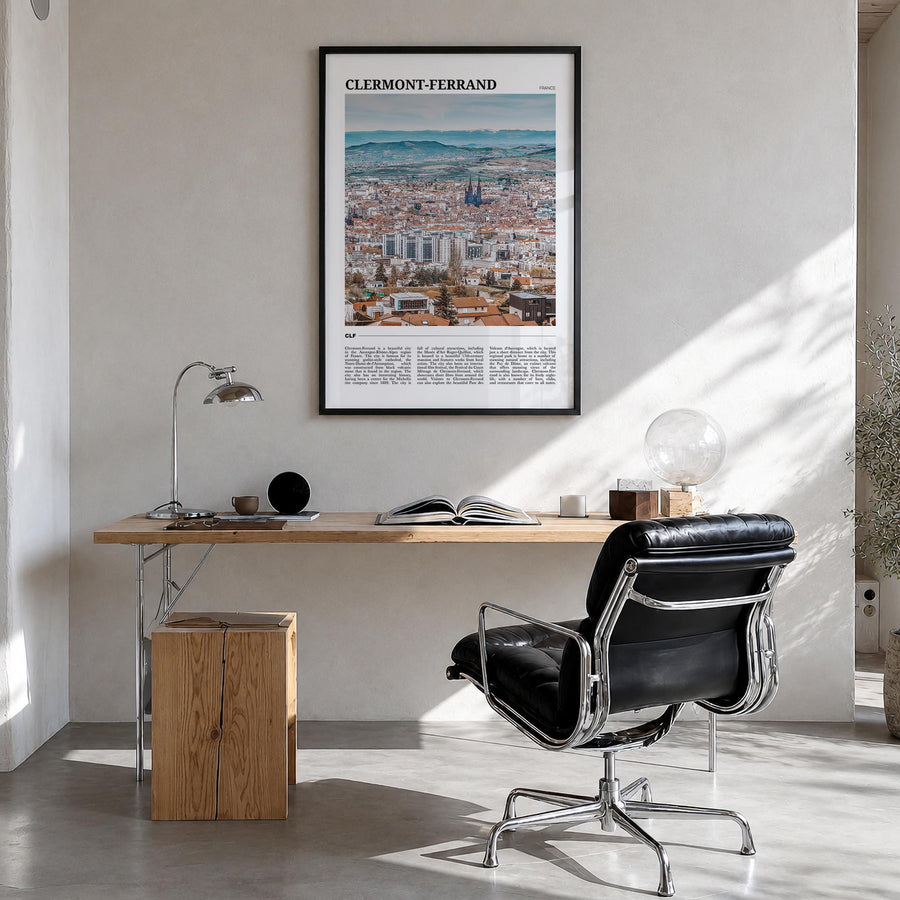 Clermont-Ferrand colorful travel poster of France – vertical wall art in black wood frame, hanging on wall