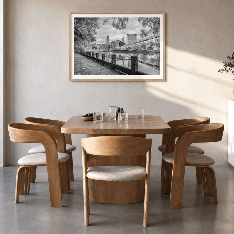 Cleveland Photo Poster in a natural wood frame, hanging in a dining room, white border