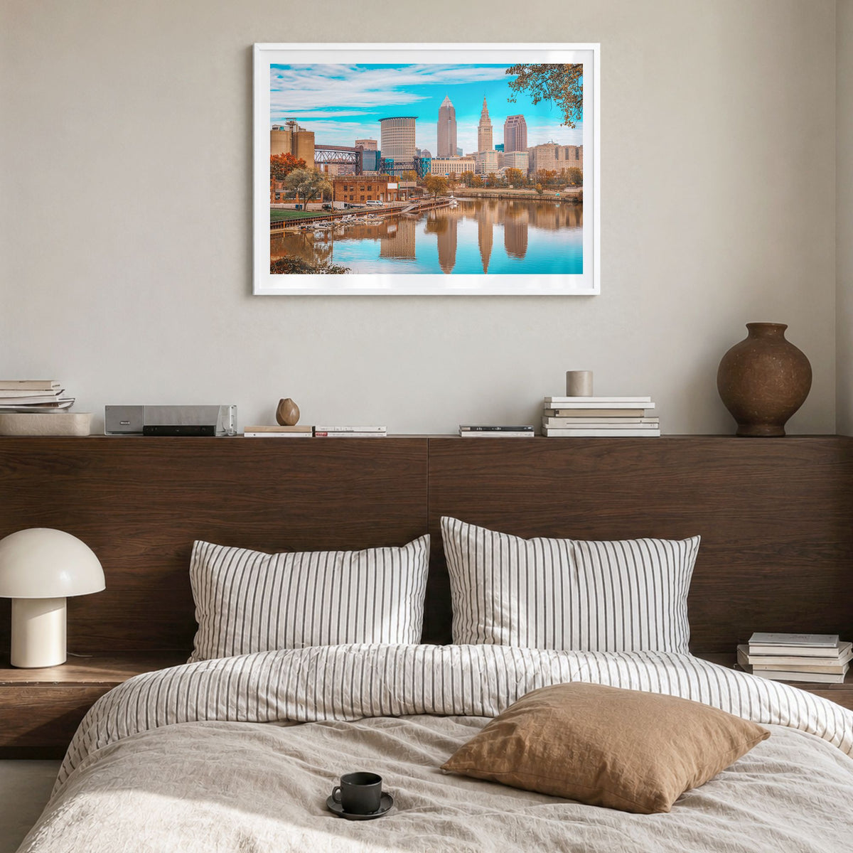 Cleveland Photo Poster in a white wood frame, hanging in a bedroom, white border