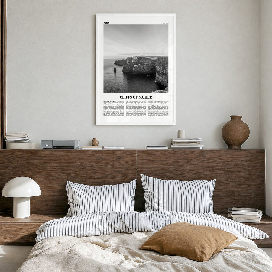 Cliffs of Moher Newspaper Poster in a white wood frame, hanging in a bedroom