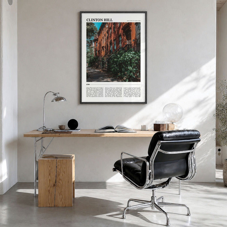 Clinton Hill Travel Poster in a black wood frame, hanging in a bright home office