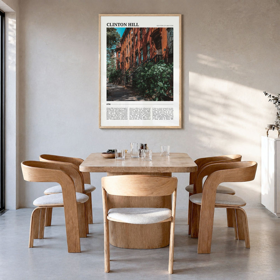 Clinton Hill Travel Poster in a natural wood frame, hanging in a dining room