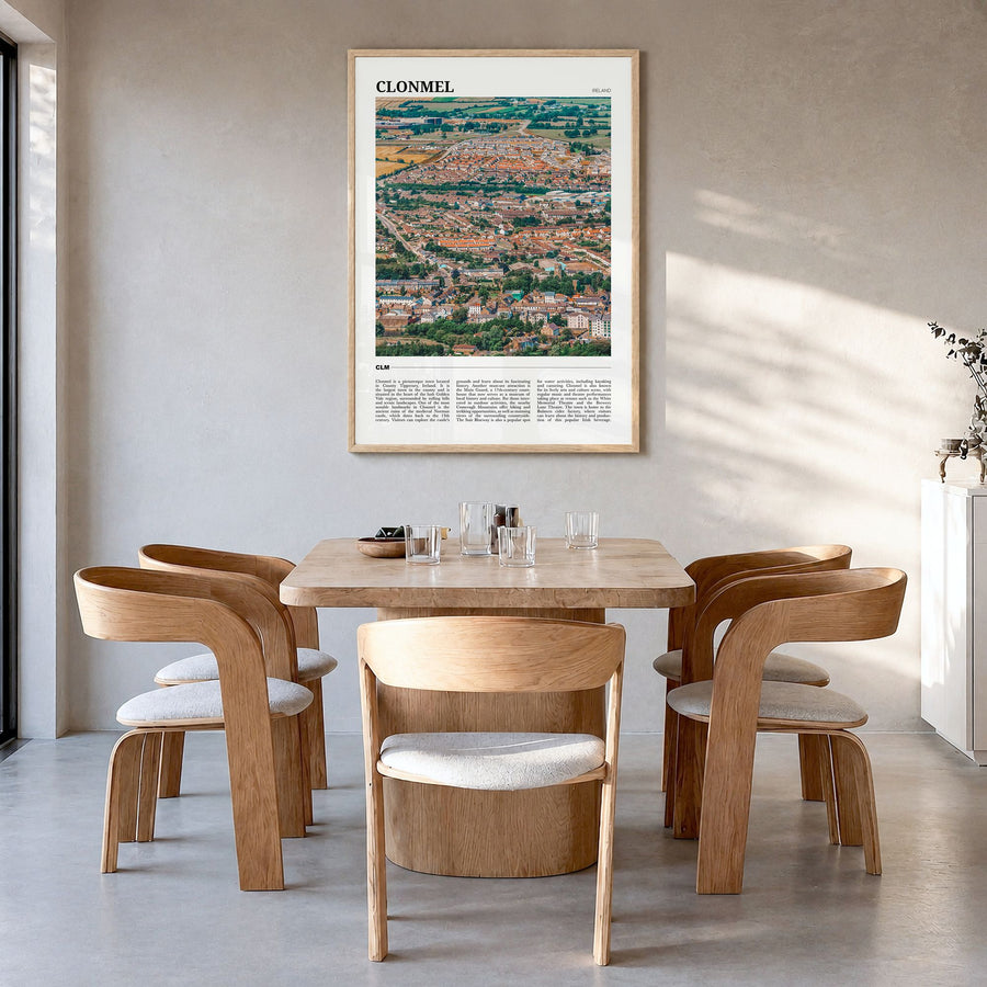 Clonmel Travel Poster in a natural wood frame, hanging in a dining room