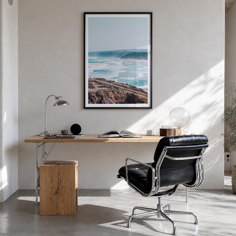 Coastline Waves colorful photo poster – vertical wall art in black wood frame with white border, hanging on wall
