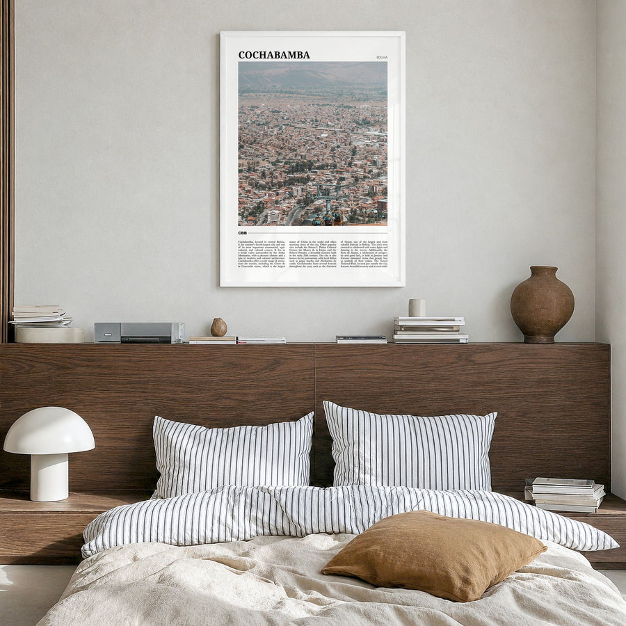 Cochabamba Travel Poster in a white wood frame, hanging in a bedroom