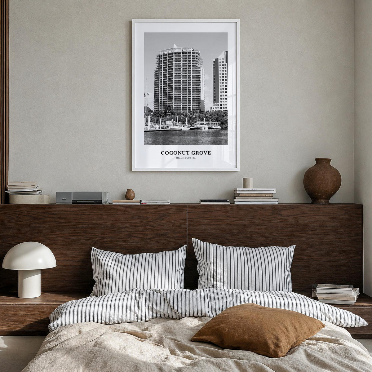 Coconut Grove black & white classic poster of Miami, Florida – vertical wall art in white wood frame, hanging on wall