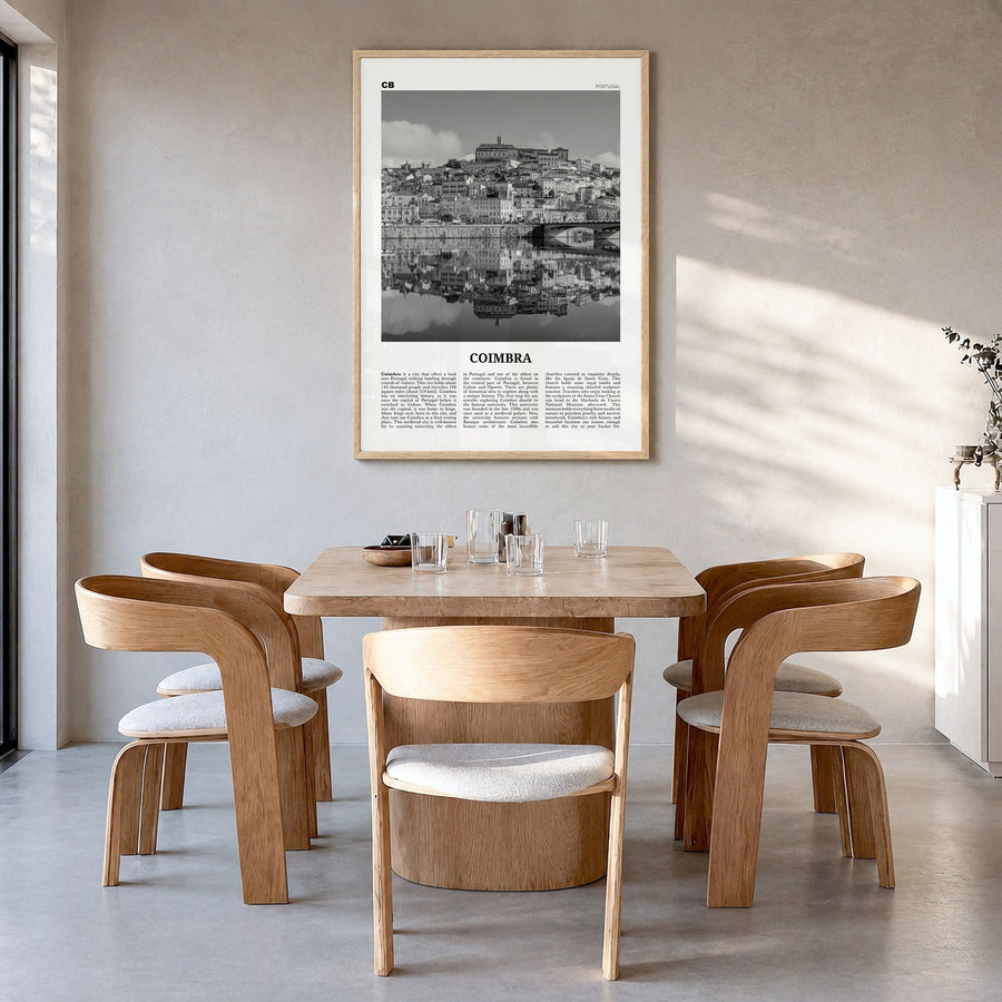 Coimbra Newspaper Poster in a natural wood frame, hanging in a dining room