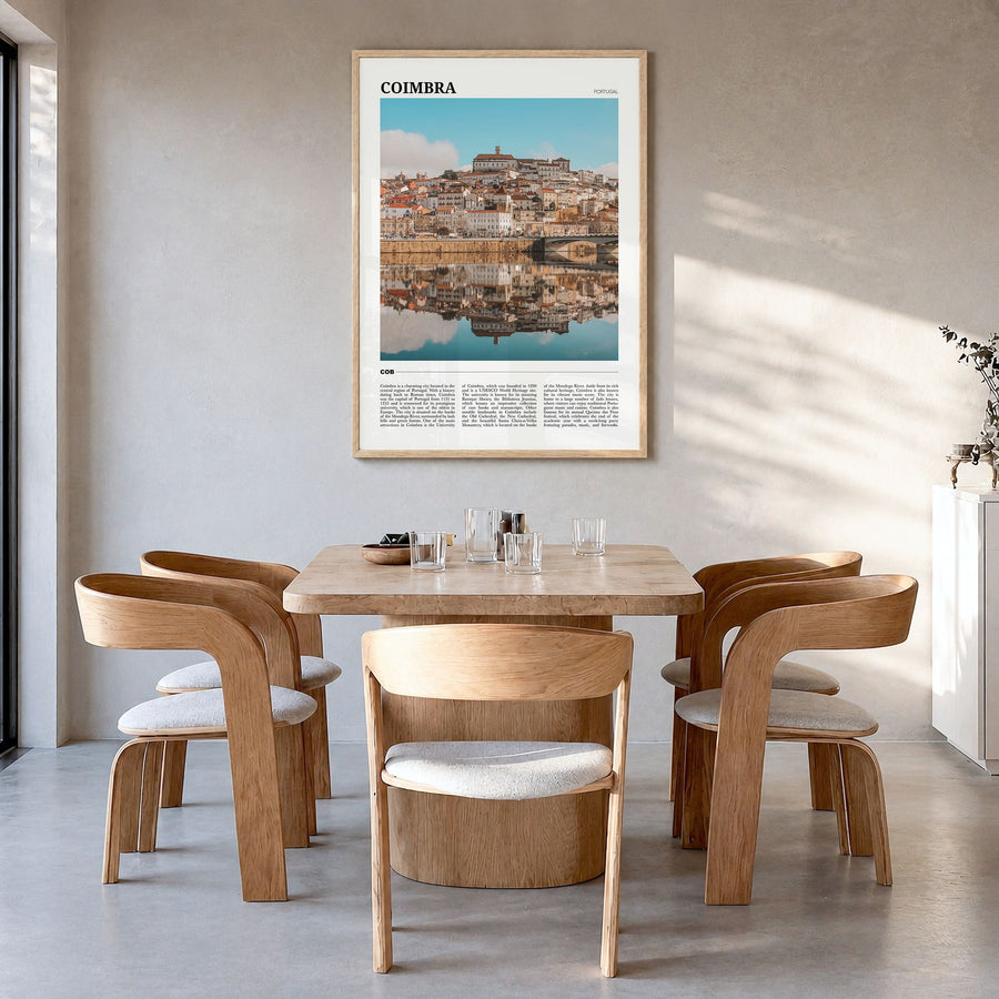 Coimbra Travel Poster in a natural wood frame, hanging in a dining room