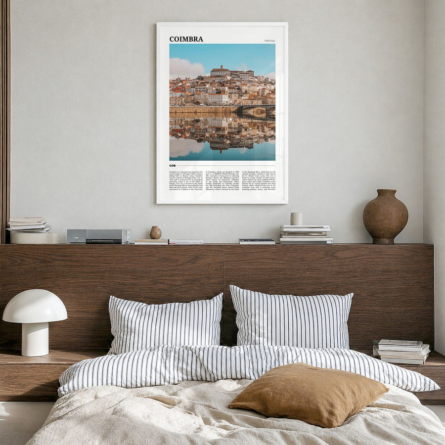 Coimbra Travel Poster in a white wood frame, hanging in a bedroom
