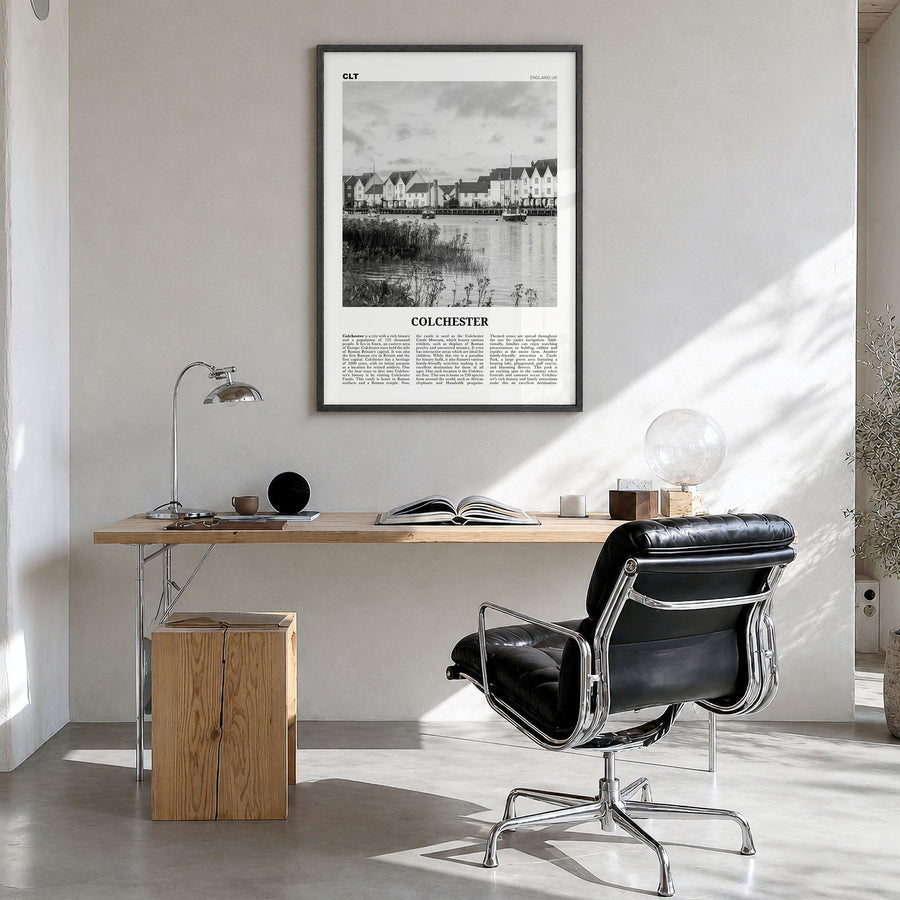 Colchester Newspaper Poster in a black wood frame, hanging in a bright home office