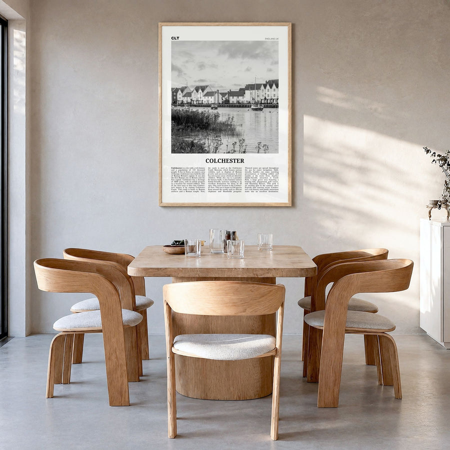 Colchester Newspaper Poster in a natural wood frame, hanging in a dining room