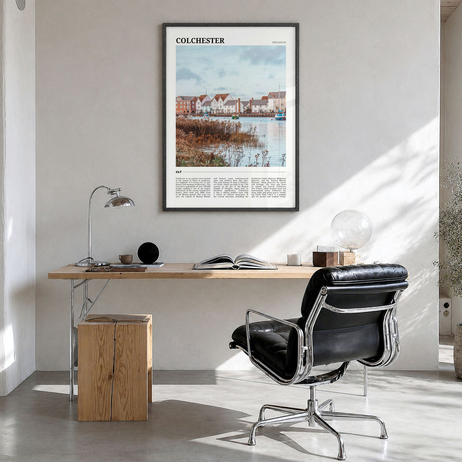 Colchester Travel Poster in a black wood frame, hanging in a bright home office