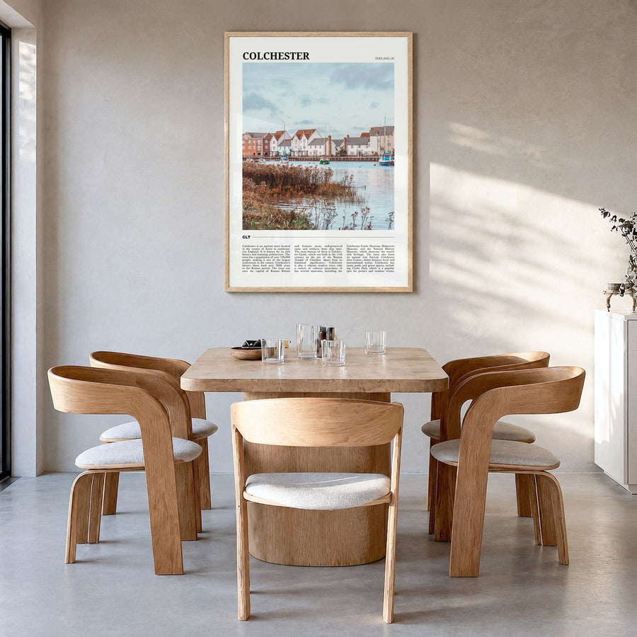 Colchester Travel Poster in a natural wood frame, hanging in a dining room