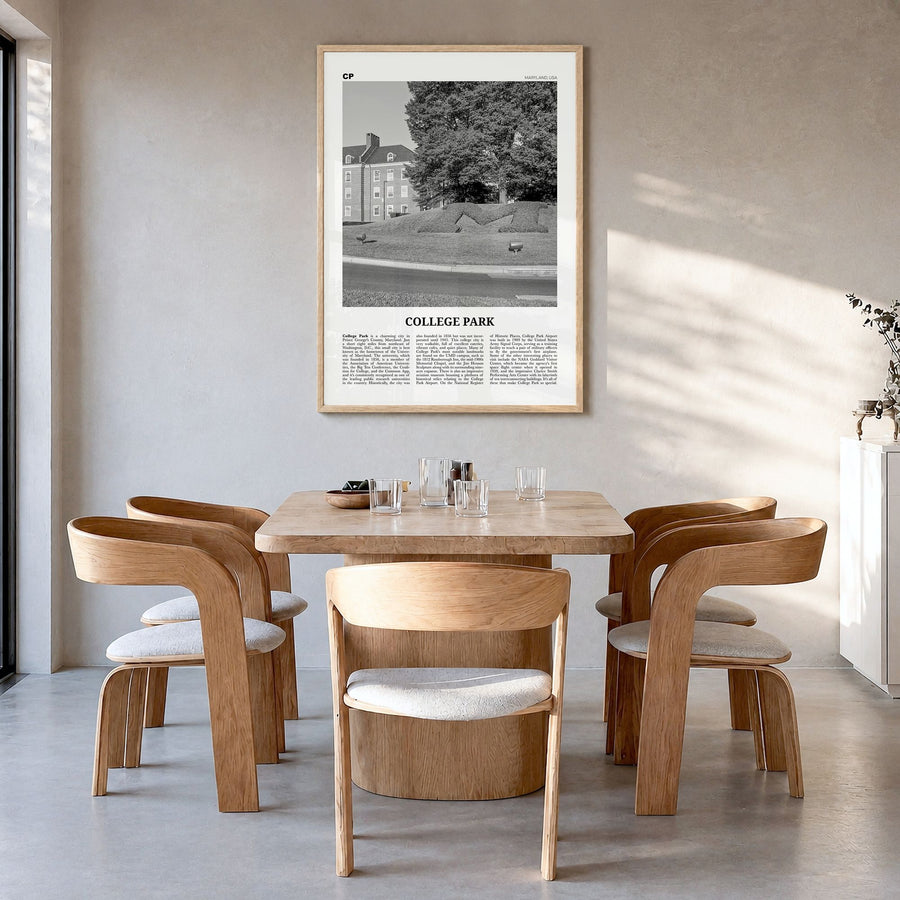 College Park Newspaper Poster in a natural wood frame, hanging in a dining room