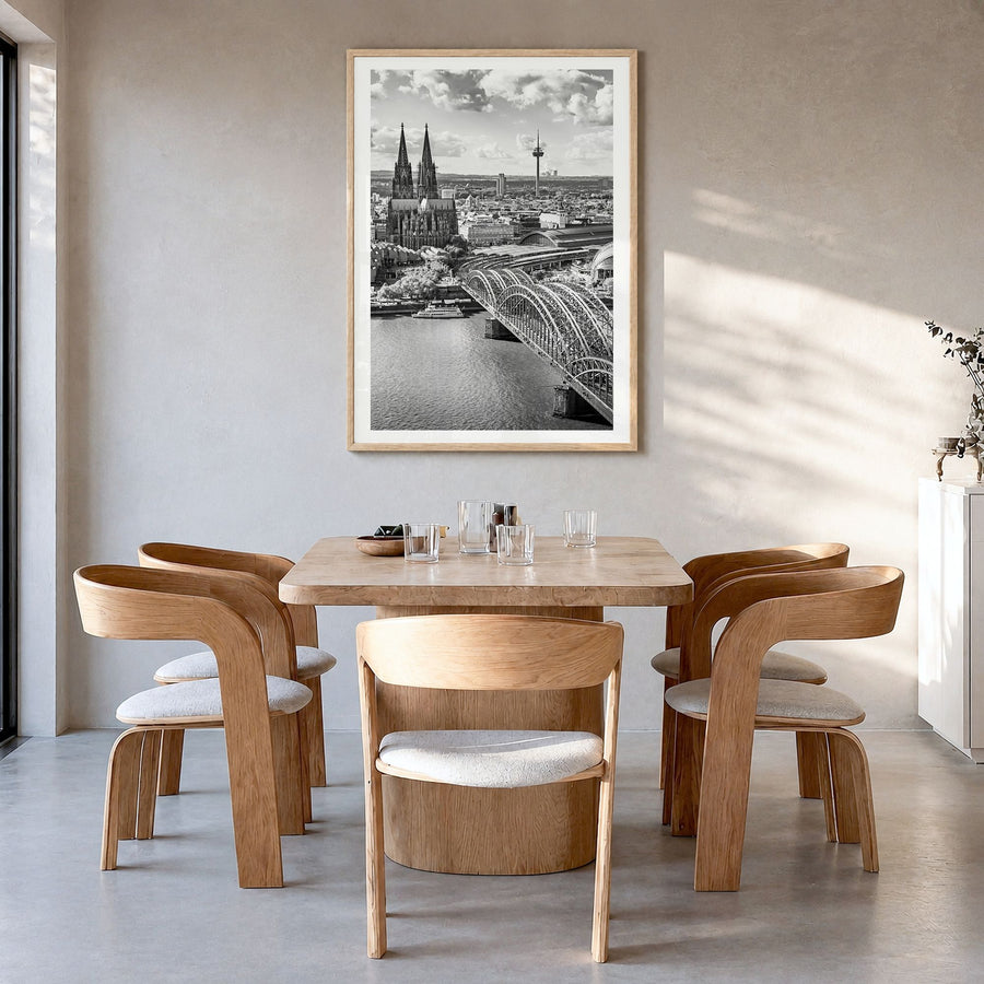 Cologne Photo Poster in a natural wood frame, hanging in a dining room, white border