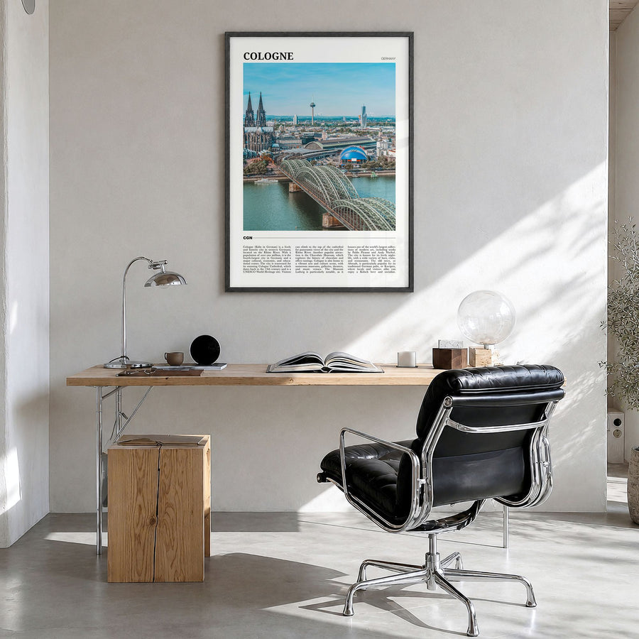 Cologne Travel Poster in a black wood frame, hanging in a bright home office