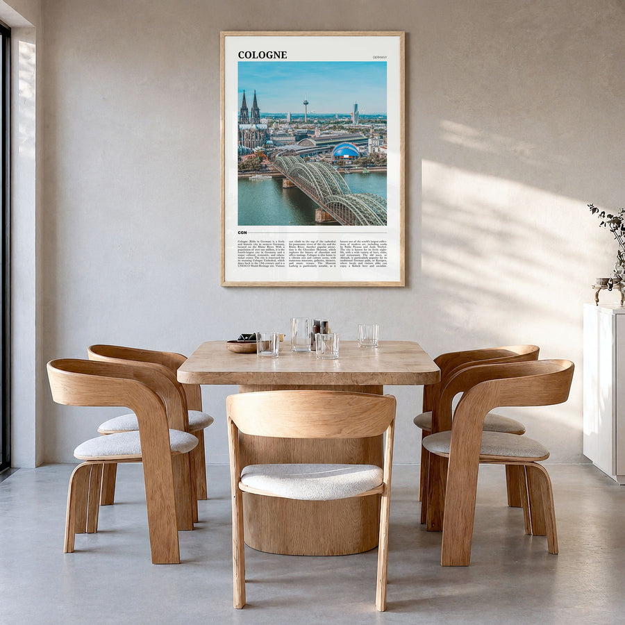 Cologne Travel Poster in a natural wood frame, hanging in a dining room