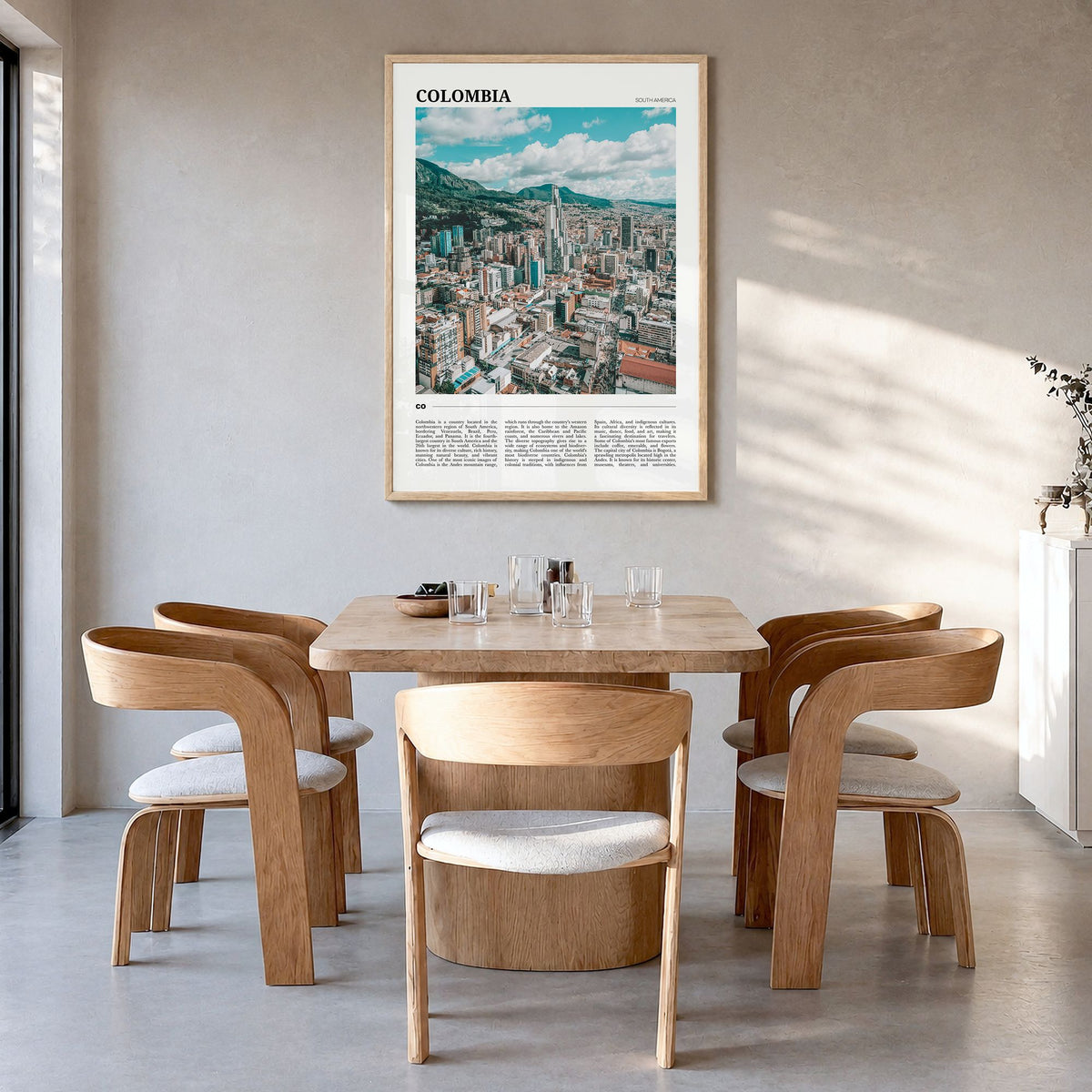 Colombia Travel No 1 Poster in a natural wood frame, hanging in a dining room
