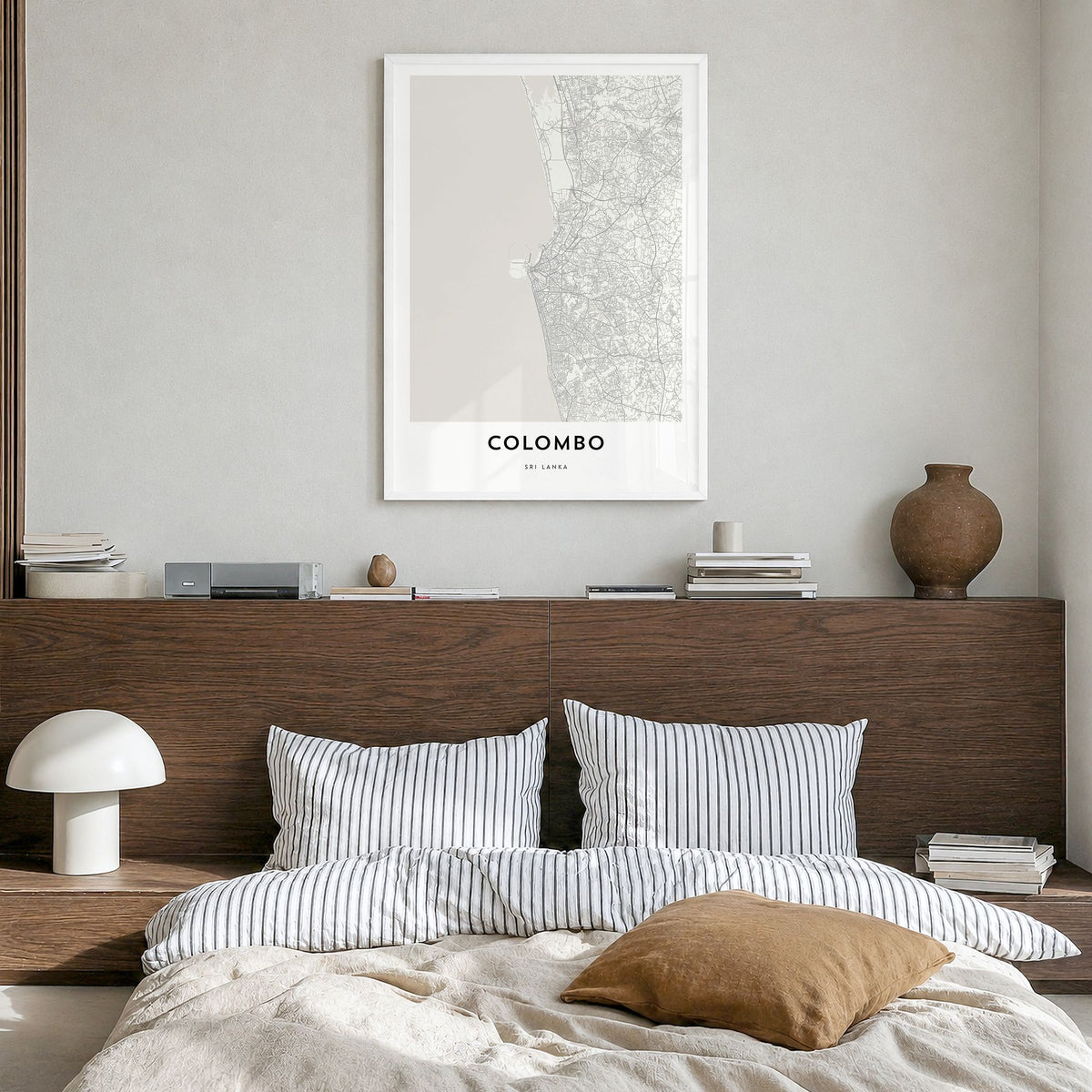 Colombo Map Poster in a white wood frame, hanging in a bedroom