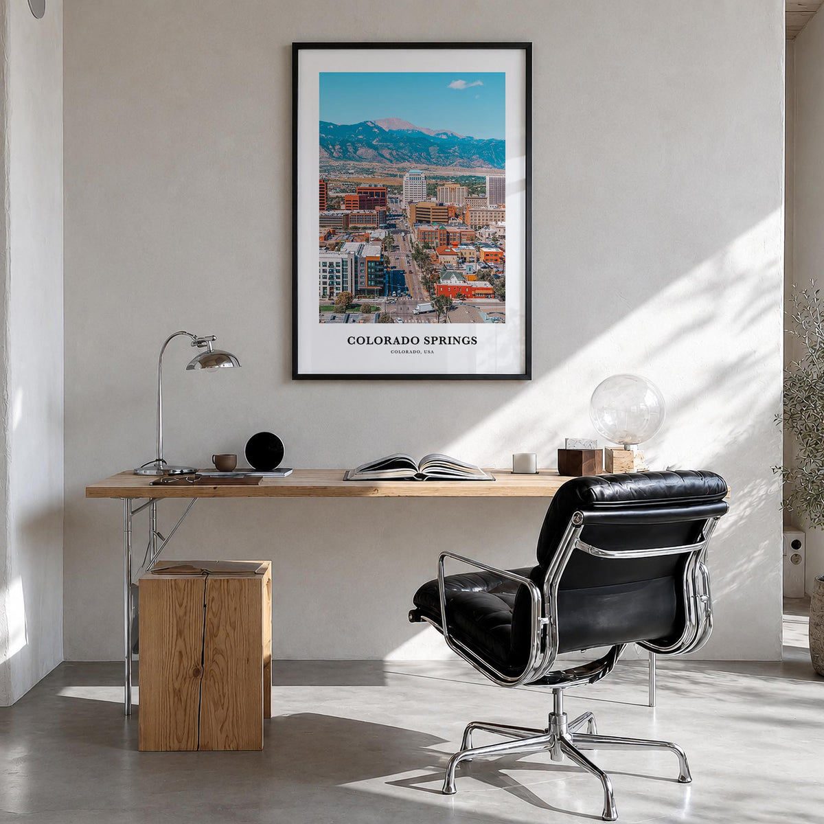 Colorado Springs colorful classic poster of Colorado, USA – vertical wall art in black wood frame, hanging on wall