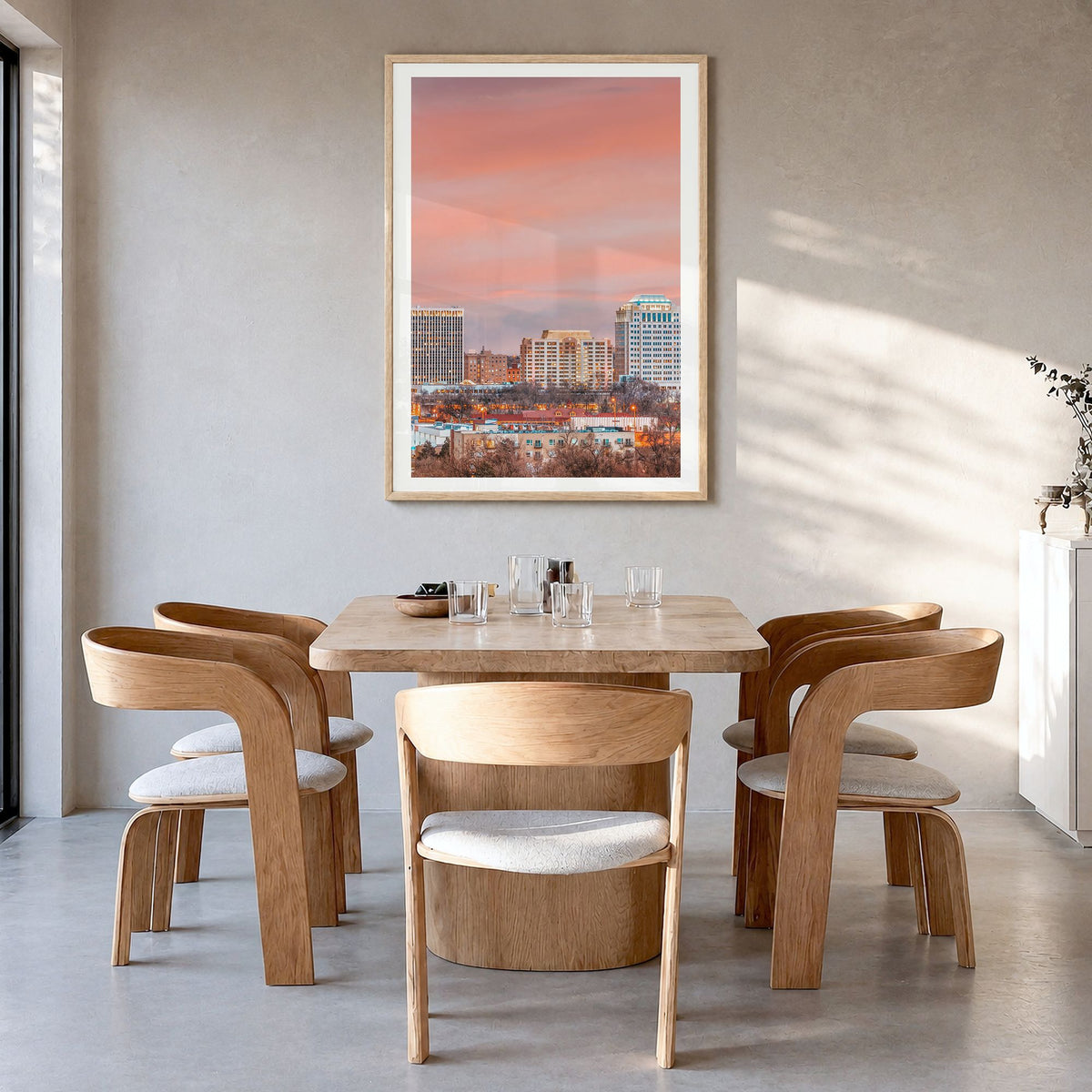 Colorado Springs Photo Poster in a natural wood frame, hanging in a dining room, white border