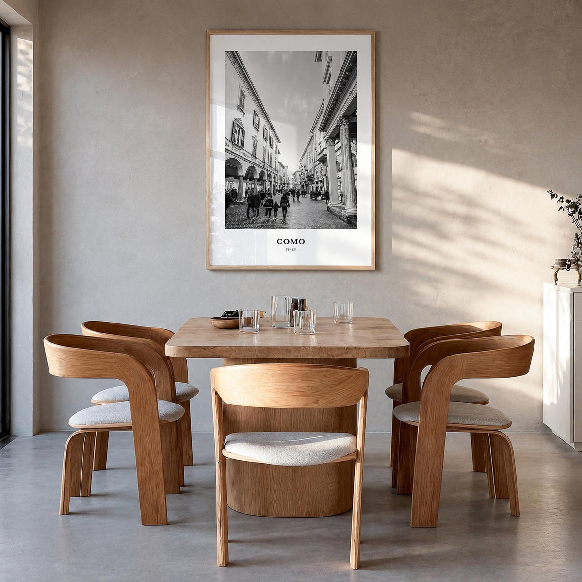 Como no. 2 black & white classic poster of Italy – vertical wall art in natural wood frame, hanging on wall