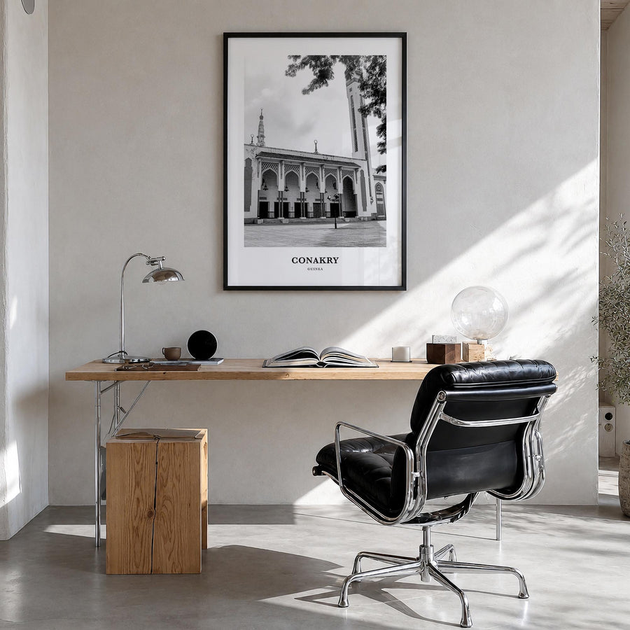 Conakry black & white classic poster of Guinea – vertical wall art in black wood frame, hanging on wall