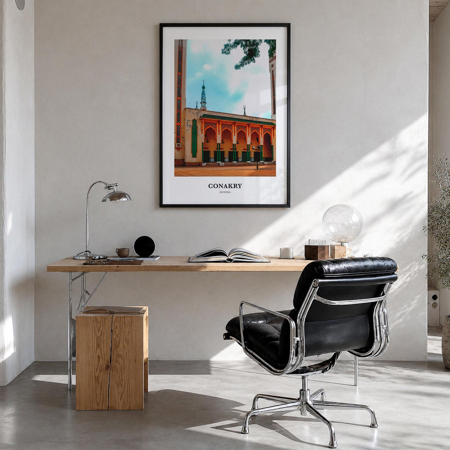 Conakry colorful classic poster of Guinea – vertical wall art in black wood frame, hanging on wall