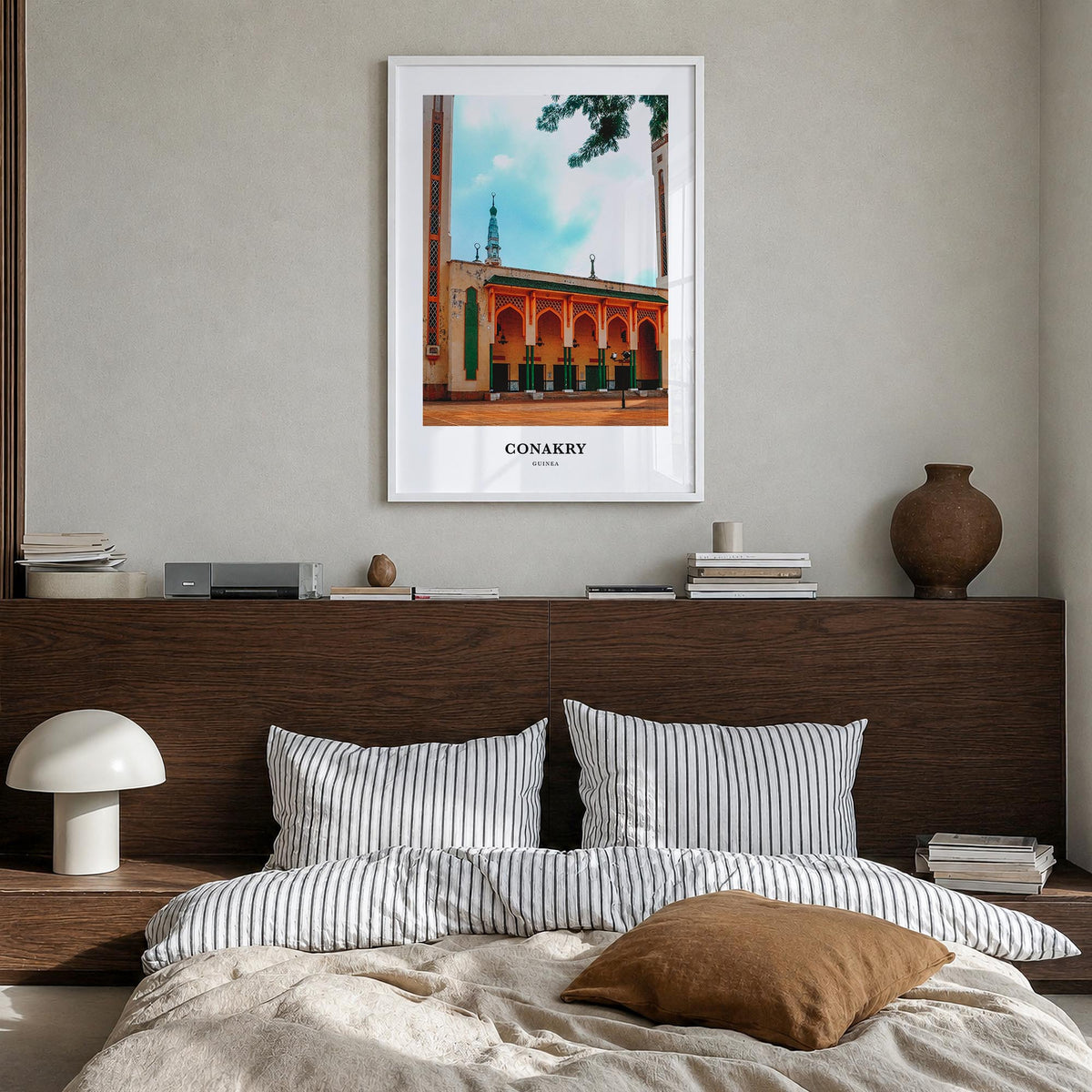 Conakry colorful classic poster of Guinea – vertical wall art in white wood frame, hanging on wall
